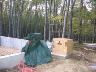2006/10/04: Generator -- for those nasty blackouts -- on pad and covered electrical panel