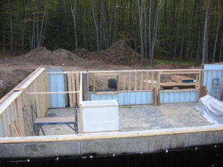 Lower level windows framed; tub/shower on site