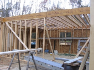Looking Northeast; shorter joists over the kitchen and dining room, leaving a cathedral ceiling over the living room