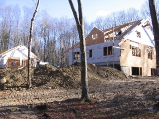 2006/11/20: Looking Southeast; dormer and West garage wall in place and, with the help of the crane again today, so are the fly rafters on the house and garage as well as the Westerly dormer beam