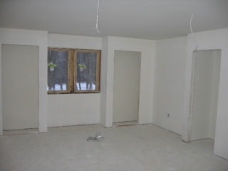 2007/02/26: Plumbing, electrical and HVAC complete; walls sheet rocked and primed for painting; looking North into the Dudley Museum, with speaker cords hanging from the ceiling