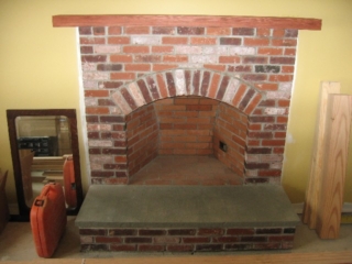 Looking West; mantle, (Colorado tumbled) brick fireplace and bluestone hearth