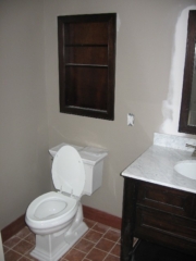 Looking Northwest into Master bath; Pottery Barn recessed shelves; Kohler Memoir toilet