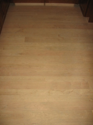 Looking West at kitchen floor; American Cherry, 3-, 4-, and 5-inch random widths, to be sanded and finished starting tomorrow
