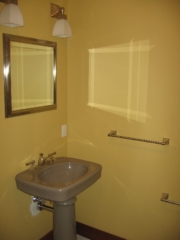 Looking Southwest in guest bathroom; Brizo toilet paper holder, towel bar, mirror and lights