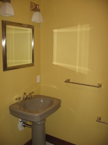 Looking Southwest in guest bathroom; Brizo toilet paper holder, towel bar, mirror and lights