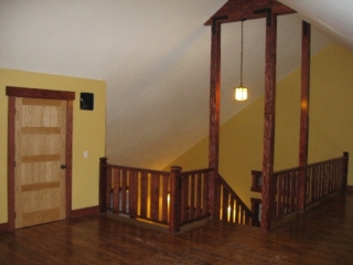 Looking Northeast at stairway to loft