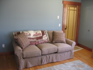 Looking Southwest at the sleeper couch in the Dudley Museum