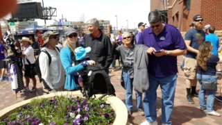 Judy proudly flashes her ticket at 20th and Blake!
