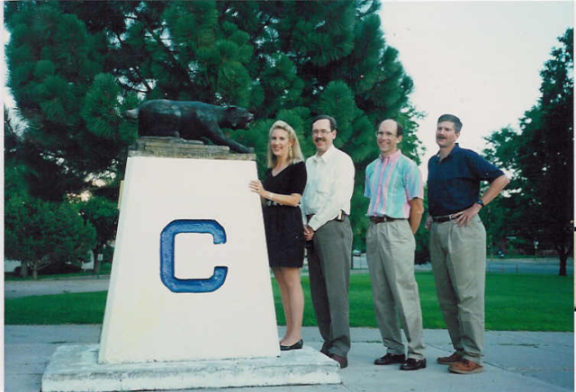 Crete (Crawford) Wood, Joseph Lee Klune, Dave Binkley and Don Dudley with the mascot in front of Central HS