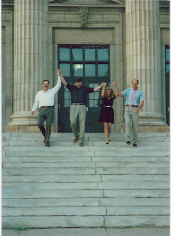 Joe Lee, Don, Crete and Dave marching down the front steps of Central HS